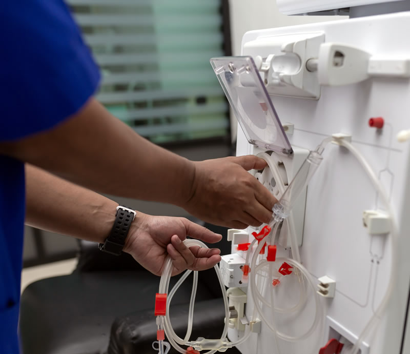 Doctor handling with haemodialysis machine
