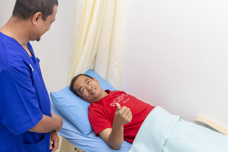 Happy patient with professional dialysis specialist